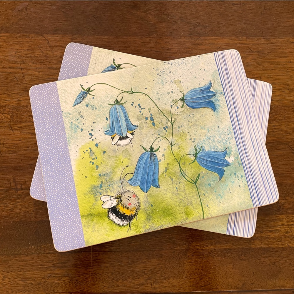 Set of two hard placemats- cork backed- bee flowers- brand new
